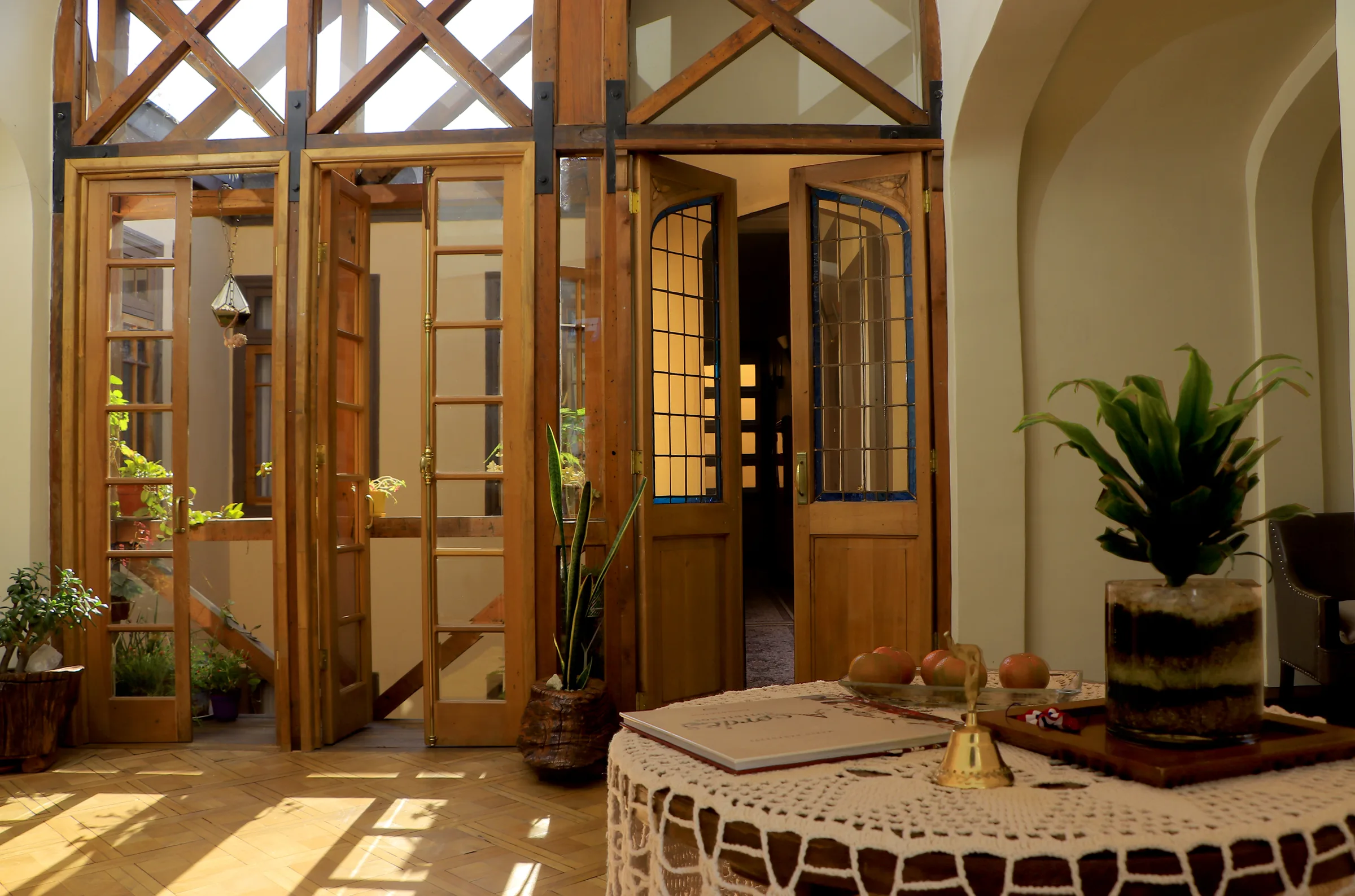 Wooden window wall and stained glass inside Casa Conde