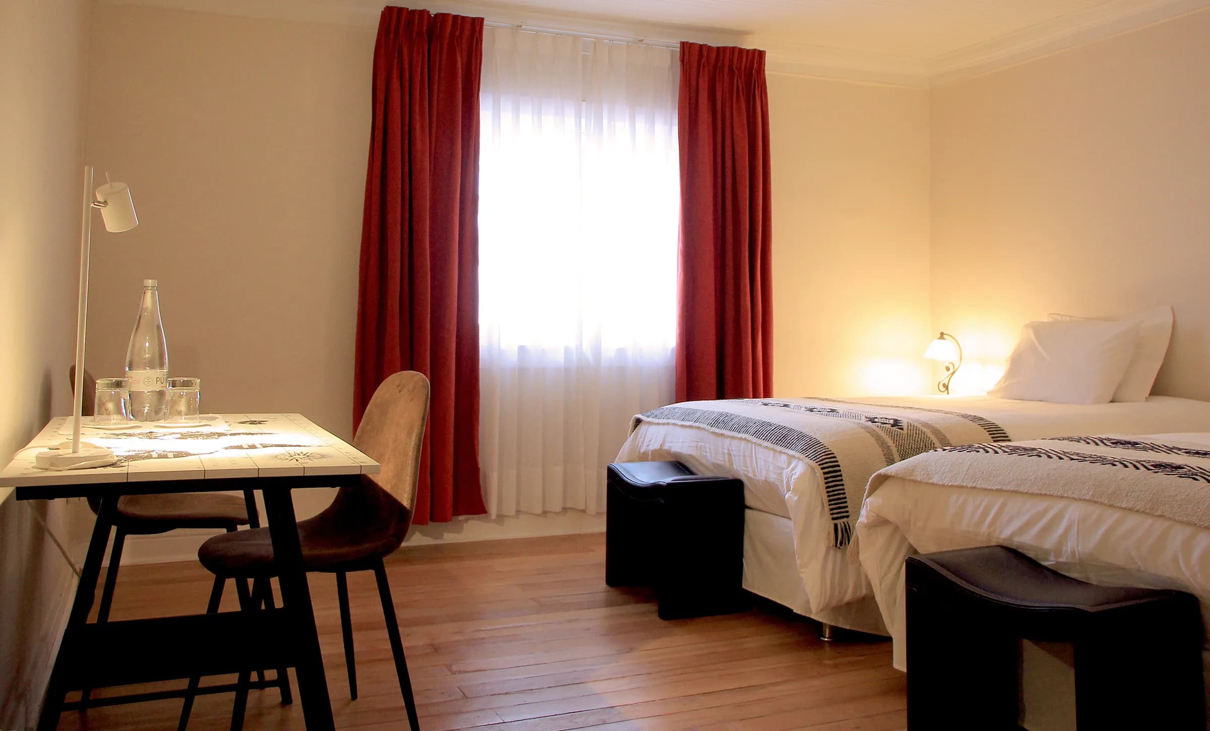 Casa Conde room with a work desk and two beds